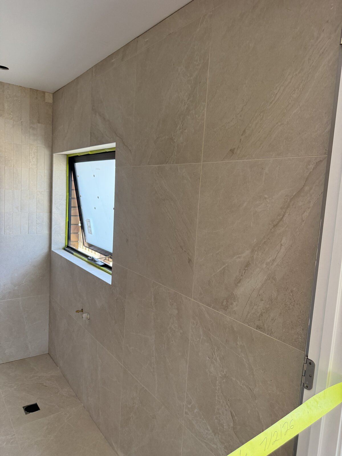 Luxury beige bathroom tiling project in Melbourne, Victoria - gallery photo