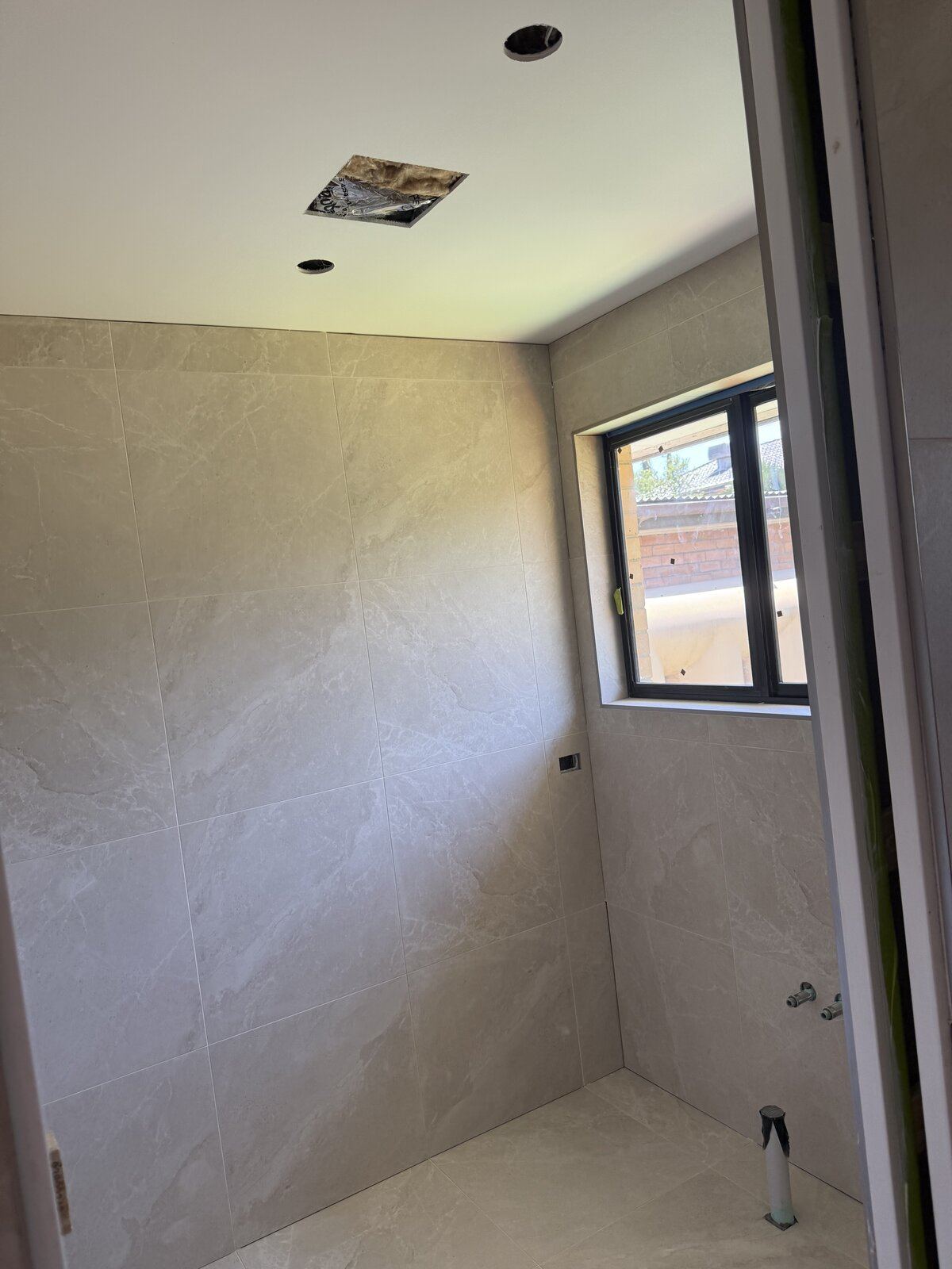 Luxury beige bathroom tiling project in Melbourne, Victoria - gallery photo